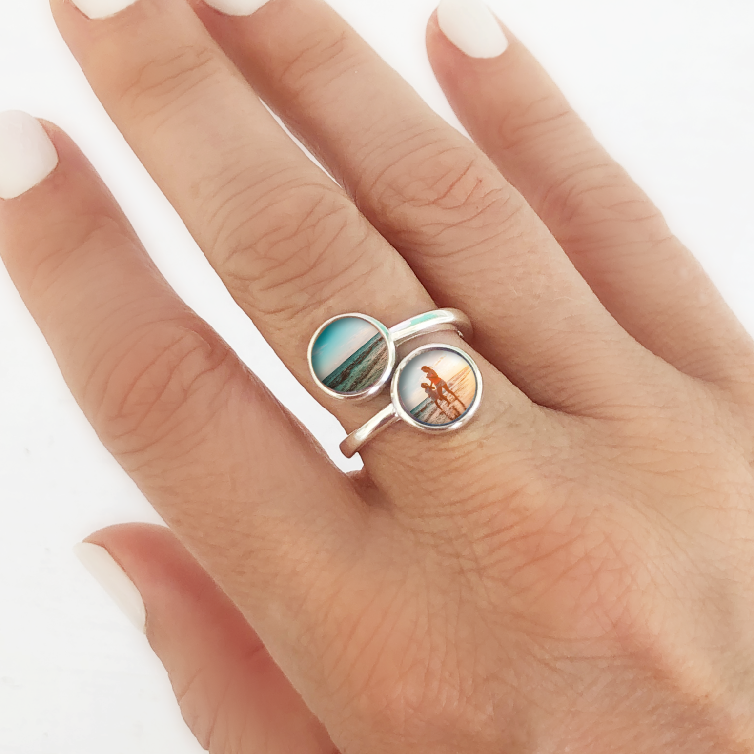 A model wearing a custom photo ring that holds two custom photos