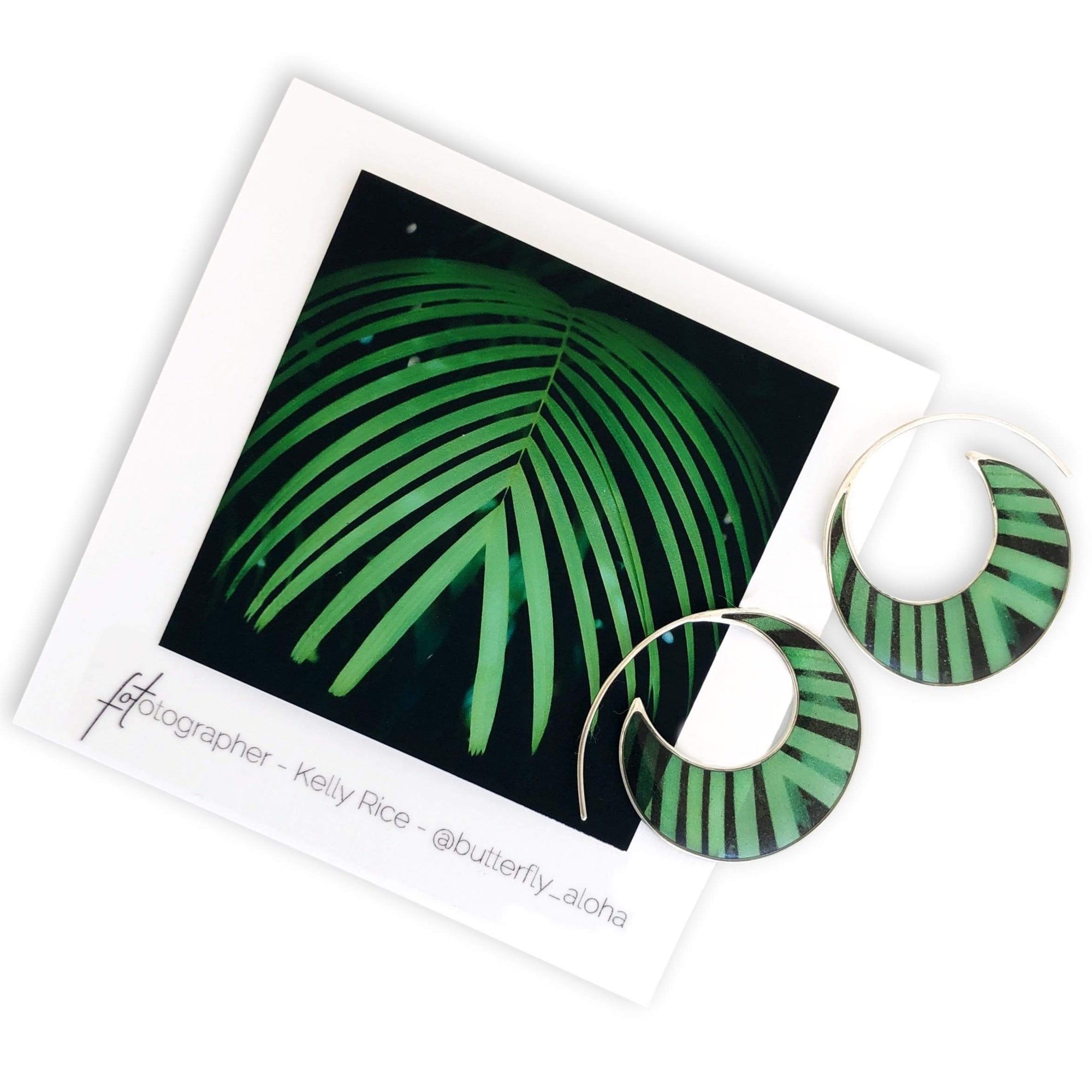 hoop earrings featuring photo of a palm leaf in green and black by Kelly Rice